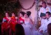 Bridesmaids, bride, priest and groom